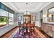 Traditional dining room with hardwood floors, a hutch, and a large window at 1600 Buckland Ct, Indian Land, SC 29707