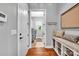 Entryway features hardwood floors, a storage bench, and access to a laundry room at 1600 Buckland Ct, Indian Land, SC 29707