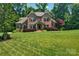 Charming two-story brick home with a beautifully manicured lawn and mature trees in a desirable neighborhood at 1600 Buckland Ct, Indian Land, SC 29707