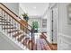 Inviting foyer with hardwood floors, staircase, and ample natural light at 1600 Buckland Ct, Indian Land, SC 29707