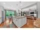 Open-concept kitchen featuring granite counters, an island, and a view into the living room at 1600 Buckland Ct, Indian Land, SC 29707