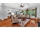 Spacious living room featuring hardwood floors, coffered ceilings, and an open layout at 1600 Buckland Ct, Indian Land, SC 29707