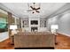 Inviting living room with custom built-ins, fireplace, and coffered ceiling at 1600 Buckland Ct, Indian Land, SC 29707