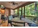 Enjoy the private porch with a dining table and serene wooded views at 1600 Buckland Ct, Indian Land, SC 29707