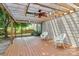 Relaxing back deck with ceiling fan and swing for enjoying the outdoors at 1817 Tradd Ave, Clover, SC 29710