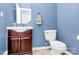 Cozy half bathroom features modern fixtures, a sink vanity, and a toilet at 1817 Tradd Ave, Clover, SC 29710