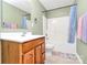 Bathroom boasting a tub shower, decorative shower curtain, and a wooden vanity at 1817 Tradd Ave, Clover, SC 29710