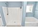 Bathroom features a shower and tub combination with a window at 1817 Tradd Ave, Clover, SC 29710