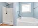 This bathroom features a white bath tub with shower and neutral walls at 1817 Tradd Ave, Clover, SC 29710