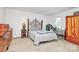 Carpeted bedroom with large wooden dresser and plenty of natural light at 1817 Tradd Ave, Clover, SC 29710