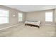Spacious carpeted bedroom with natural light from three windows at 1817 Tradd Ave, Clover, SC 29710
