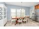 Bright dining area with stainless refrigerator, large table and chairs, and ample natural light at 1817 Tradd Ave, Clover, SC 29710