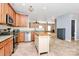 Open kitchen features stainless steel appliances, wooden cabinets, and an island prep area at 1817 Tradd Ave, Clover, SC 29710