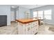 Spacious kitchen with a wooden island and breakfast nook seating area with lots of natural light at 1817 Tradd Ave, Clover, SC 29710