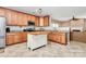 Kitchen with an island, stainless appliances, granite countertops, and warm wood cabinetry at 1817 Tradd Ave, Clover, SC 29710