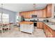 Well-lit kitchen boasts stainless appliances, a kitchen island, and ample cabinet storage at 1817 Tradd Ave, Clover, SC 29710