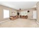 Cozy living room with ample natural light, neutral paint, and comfortable seating at 1817 Tradd Ave, Clover, SC 29710