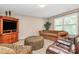 Cozy living room includes a large window for natural light and comfortable seating options at 1817 Tradd Ave, Clover, SC 29710