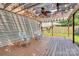 Relaxing pergola-covered deck featuring a ceiling fan and ample space for outdoor enjoyment at 1817 Tradd Ave, Clover, SC 29710