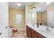 Bright bathroom featuring a double sink vanity, large mirror, and a separate tub and shower at 18715 Coachmans Trce, Cornelius, NC 28031