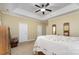 Spacious bedroom features tray ceiling, traditional furniture, and ample natural light at 18715 Coachmans Trce, Cornelius, NC 28031