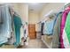 Organized walk-in closet with shelving, hanging space, and room for storage at 18715 Coachmans Trce, Cornelius, NC 28031