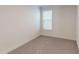 Carpeted bedroom illuminated by a window, offering a cozy space at 2070 Skyhawk Dr, York, SC 29745