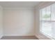 Carpeted bedroom with a large window and a bright, neutral color scheme at 2070 Skyhawk Dr, York, SC 29745