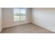 Carpeted bedroom with a window allowing natural light at 2070 Skyhawk Dr, York, SC 29745