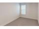 Carpeted bedroom illuminated by a window, providing a cozy space at 2070 Skyhawk Dr, York, SC 29745