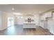 Bright, open-concept kitchen with white cabinets, stainless steel appliances, and a center island at 2070 Skyhawk Dr, York, SC 29745