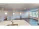 Open-concept kitchen with a center island, stainless steel appliances, and a view of the living area at 2070 Skyhawk Dr, York, SC 29745