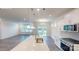 Modern kitchen featuring a large island with quartz countertops, stainless steel sink, and pendant lighting at 2070 Skyhawk Dr, York, SC 29745