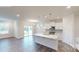Bright, open-concept kitchen with white cabinets, stainless steel appliances, and a center island at 2070 Skyhawk Dr, York, SC 29745