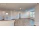 Open living room features wood floors, recessed lighting and large windows for ample natural light at 2070 Skyhawk Dr, York, SC 29745