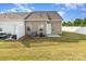 Townhome backyard featuring a cozy patio and white fences at 218 Canina Ln, Indian Trail, NC 28079