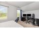 Bright bedroom featuring a golf bag, and desk area with dual monitors at 218 Canina Ln, Indian Trail, NC 28079