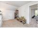 Spacious bonus room with shelving for display and a view into the bedroom at 218 Canina Ln, Indian Trail, NC 28079