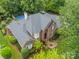 Brick home with mature landscaping, basketball court, and a spacious backyard at 2300 Richardson Dr, Charlotte, NC 28211