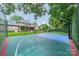 Backyard basketball court with surrounding fence for friendly competition at 2300 Richardson Dr, Charlotte, NC 28211