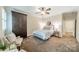 Comfortable bedroom with soft carpet, neutral colors, and ample closet space at 2300 Richardson Dr, Charlotte, NC 28211