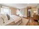 Bright bedroom with hardwood floors, natural light, and French doors leading to outdoors at 2300 Richardson Dr, Charlotte, NC 28211