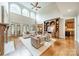 Grand living room with hardwood floors, soaring windows, high ceilings, and built in cabinetry at 2300 Richardson Dr, Charlotte, NC 28211