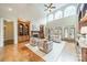 Inviting living area featuring hardwood floors, high ceilings, and large windows offering lots of natural light at 2300 Richardson Dr, Charlotte, NC 28211