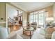 Open-concept layout featuring hardwood floors, stairs, front door, and a view of the dining room at 2300 Richardson Dr, Charlotte, NC 28211