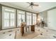 Bright office space featuring large windows, plantation shutters, and neutral decor at 2300 Richardson Dr, Charlotte, NC 28211