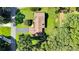 Overhead view of the home featuring lush landscaping, mature trees, and private driveway at 2326 Horseshoe Bend Ne Rd, Hickory, NC 28601