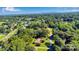 Scenic aerial view showing the home's location in a quiet, tree-filled neighborhood at 2326 Horseshoe Bend Ne Rd, Hickory, NC 28601