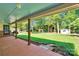 View from the back porch to the spacious, green backyard and detached shed at 2326 Horseshoe Bend Ne Rd, Hickory, NC 28601