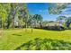 Grassy backyard featuring a swing set and mature trees at 2326 Horseshoe Bend Ne Rd, Hickory, NC 28601